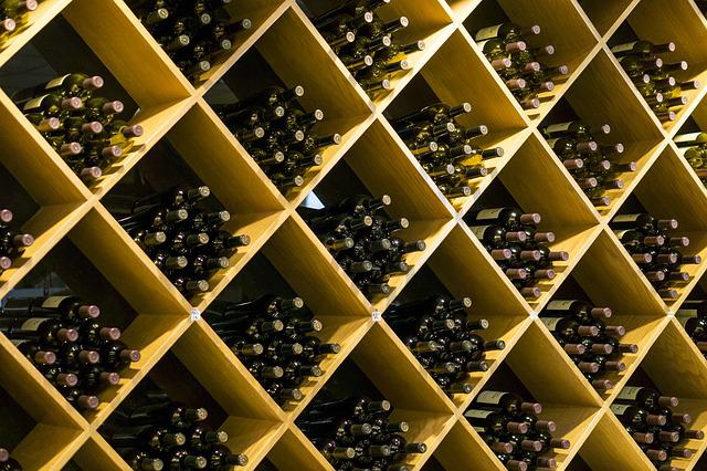 Bottles of wine in cubbies on a shelf